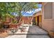 Cozy backyard featuring desert landscaping and privacy walls at 1562 Pimlico Hills St, Henderson, NV 89014