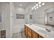 Bathroom featuring a double sink vanity and a shower-tub combo at 1562 Pimlico Hills St, Henderson, NV 89014