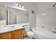 Bright bathroom featuring a single sink vanity and a shower-tub combo at 1562 Pimlico Hills St, Henderson, NV 89014