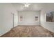 Spacious bedroom with carpet, ceiling fan, and well-lit with three windows at 1562 Pimlico Hills St, Henderson, NV 89014