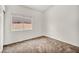 Bright bedroom featuring clean carpets, large window, and neutral walls at 1562 Pimlico Hills St, Henderson, NV 89014