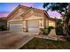 Charming home with a three-car garage and well-maintained landscaping at 1562 Pimlico Hills St, Henderson, NV 89014