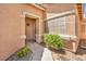 Inviting front entry with stone accents and a well-lit pathway at 1562 Pimlico Hills St, Henderson, NV 89014