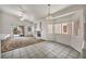 Bright living room featuring a fireplace, ceiling fan, and sliding glass doors at 1562 Pimlico Hills St, Henderson, NV 89014