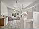 Bright living room featuring a fireplace and sliding glass door to the backyard at 1562 Pimlico Hills St, Henderson, NV 89014