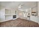 Bright living room with fireplace and connecting breakfast bar to the kitchen at 1562 Pimlico Hills St, Henderson, NV 89014