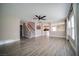 Spacious living room with hardwood floors, lots of natural light, a ceiling fan, and staircase at 189 Kings Canyon Ct, Henderson, NV 89012