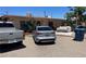 A view of the home's exterior featuring desert landscaping and ample parking space at 1902 Weldon Pl, Las Vegas, NV 89104