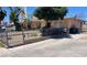 Charming home with desert landscaping and mature trees visible from the street at 1902 Weldon Pl, Las Vegas, NV 89104