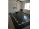 Bright living room featuring large windows, decorative tile floors, and fresh paint at 1902 Weldon Pl, Las Vegas, NV 89104