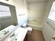 A clean bathroom featuring a sink, mirror, toilet and shower with tile floor at 1920 Hodgenville St # 106, Las Vegas, NV 89106