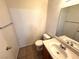 A bathroom featuring a vanity with a sink, mirror, and a toilet at 1920 Hodgenville St # 106, Las Vegas, NV 89106