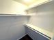 A well-organized walk-in closet featuring ample shelving and hanging space for optimal storage solutions at 1920 Hodgenville St # 106, Las Vegas, NV 89106