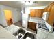 Functional kitchen with white appliances, oak cabinets, and marble countertops at 1920 Hodgenville St # 106, Las Vegas, NV 89106