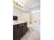 Bathroom with tile floors, tub and shower, white walls, and dark wood vanity at 1920 Silver St, Pahrump, NV 89048