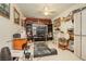 Functional bedroom features built-in shelves and storage, with ceiling fan and treadmill at 1920 Silver St, Pahrump, NV 89048