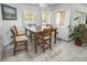 Breakfast nook with a wooden table, view to the backyard pool area, and natural light from multiple windows at 1920 Silver St, Pahrump, NV 89048