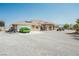 Charming single-story home with a two-car garage and ample parking on a gravel driveway at 1920 Silver St, Pahrump, NV 89048