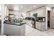 Well-equipped kitchen with a double sink, ample counter space, stainless steel appliances and access to a pantry at 1920 Silver St, Pahrump, NV 89048