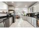 Bright kitchen showcasing stainless steel appliances, modern cabinetry, granite countertops, and tile floors at 1920 Silver St, Pahrump, NV 89048
