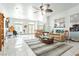Spacious living room with tile flooring, ceiling fans, and an open layout ideal for modern living and entertaining at 1920 Silver St, Pahrump, NV 89048