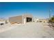 Large metal shed with an open door and gravel surrounding it at 1920 Silver St, Pahrump, NV 89048