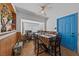 Bright dining area featuring a large window, neutral walls, and tile flooring at 214 Earl St, Las Vegas, NV 89101