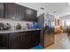 This home's kitchen features stainless steel appliances, granite countertops, and dark cabinetry at 214 Earl St, Las Vegas, NV 89101