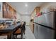 The kitchen featuring stainless steel appliances, laminate countertops, and light-colored cabinets at 214 Earl St, Las Vegas, NV 89101