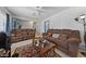 The living room features tile flooring, a ceiling fan, and neutral-colored walls at 214 Earl St, Las Vegas, NV 89101