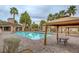 Relaxing community pool area with comfortable seating, lush landscaping, and serene atmosphere at 251 S Green Valley Pkwy # 1514, Henderson, NV 89012