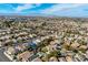 An aerial view of the neighborhood in relation to the city on the horizon at 254 Camelback Ridge Ave, Henderson, NV 89012