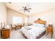Cozy bedroom with natural light, vintage furniture, a ceiling fan, and soothing neutral tones creates a calm retreat at 254 Camelback Ridge Ave, Henderson, NV 89012