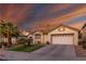 Charming single-story home with a well-manicured lawn and a two-car garage in a residential neighborhood at 254 Camelback Ridge Ave, Henderson, NV 89012