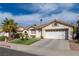 Attractive single-Gathering home with a two-car garage and landscaped front yard at 254 Camelback Ridge Ave, Henderson, NV 89012