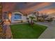 Charming single-story home with a well-manicured lawn and desert landscaping at 254 Camelback Ridge Ave, Henderson, NV 89012