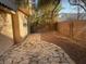A cozy backyard with a stone patio, perfect for outdoor relaxation and entertaining at 2637 Heathrow St, Las Vegas, NV 89135