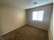 Neutral bedroom featuring a window, neutral carpeting and walls with natural light at 2637 Heathrow St, Las Vegas, NV 89135
