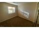 A cozy bedroom with neutral walls and carpet, featuring a window that allows natural light at 2637 Heathrow St, Las Vegas, NV 89135