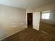A bedroom includes carpeted floors, natural light, and a mirrored closet at 2637 Heathrow St, Las Vegas, NV 89135