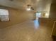 Spacious living room with tile floors, ceiling fan, and natural light from the window at 2637 Heathrow St, Las Vegas, NV 89135