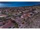 Scenic aerial image of a landscaped home in a community setting with desert flora and mountain views in the background at 2747 White Sage Dr, Henderson, NV 89052
