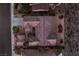 Bird's eye view of a house with a detailed roof and desert landscaping, providing a serene and private backyard space at 2747 White Sage Dr, Henderson, NV 89052