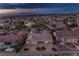 Aerial perspective of a well-kept home with a desert-style yard and a community featuring a diverse range of houses at 2747 White Sage Dr, Henderson, NV 89052