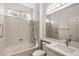 Updated bathroom with bright light, white tiling and fixtures, modern sink, and shower and tub combo at 2747 White Sage Dr, Henderson, NV 89052