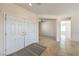 Inviting foyer with neutral tile flooring and a double door entry at 2747 White Sage Dr, Henderson, NV 89052