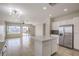 Open concept kitchen showcases stainless steel appliances, island, and view at 2747 White Sage Dr, Henderson, NV 89052