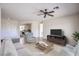 Staged living room with comfortable seating and entertainment area at 2747 White Sage Dr, Henderson, NV 89052