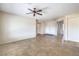 Spacious living room with neutral walls, tile flooring, and ceiling fan at 2747 White Sage Dr, Henderson, NV 89052