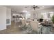 Staged open-concept living space with kitchen, dining, and living areas at 2747 White Sage Dr, Henderson, NV 89052